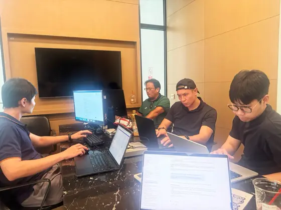 Edge8 engineers working at their laptops