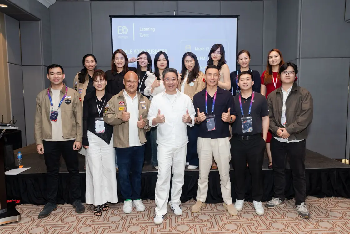 The Edge8 team on stage after an event